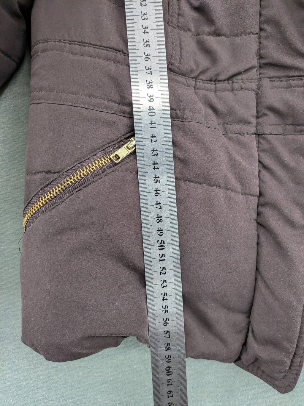 Vero Moda grey quilted jacket with high funnel neck and zippered pockets.