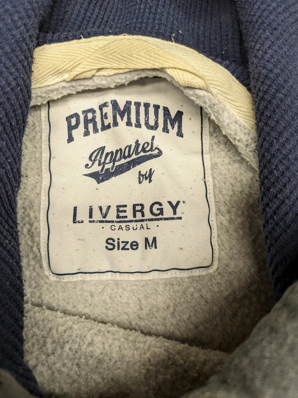 Livergy grey zip-through hoodie with "Traditional Authentic" graphic, kangaroo pocket, soft material.