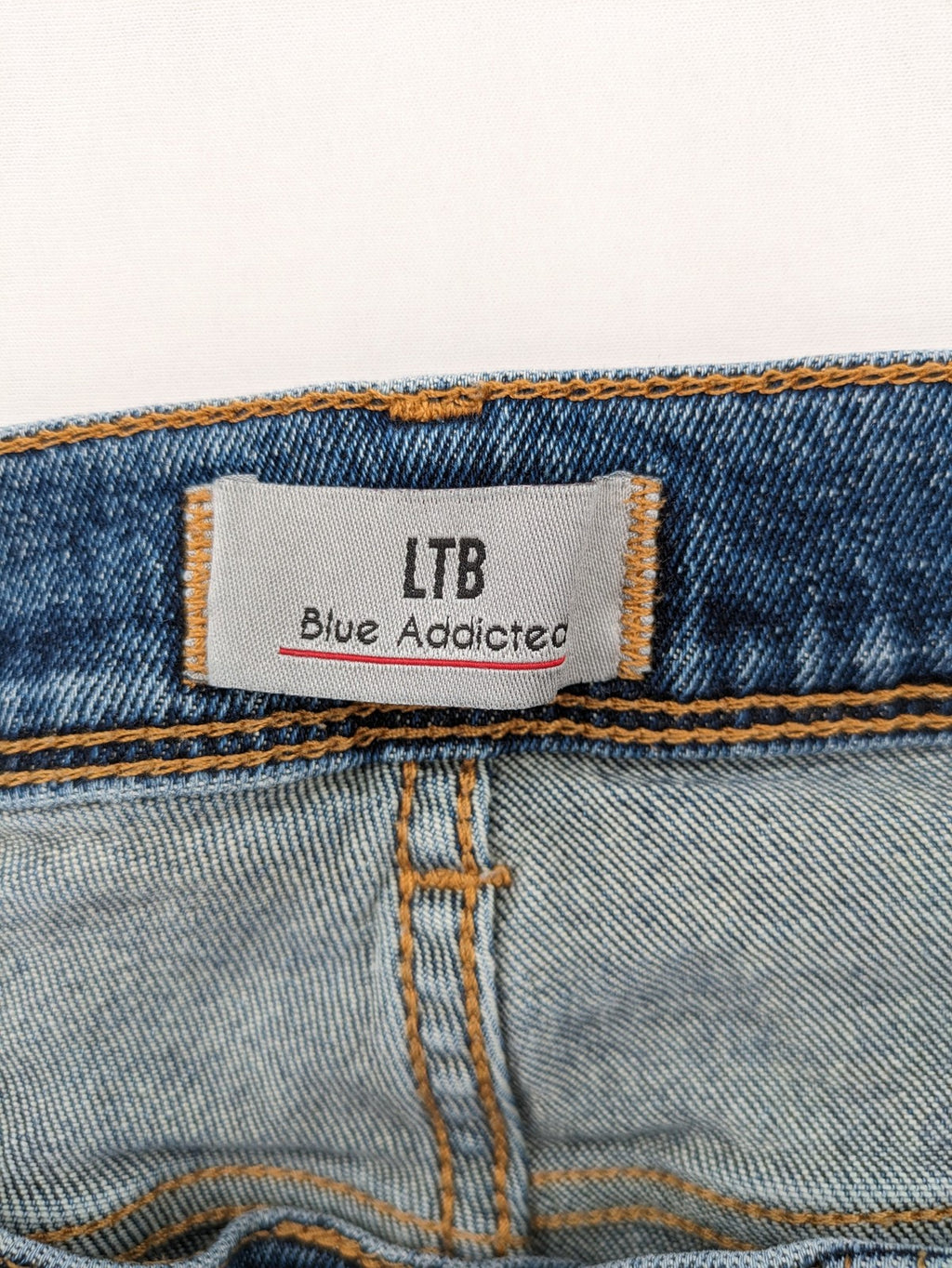LTB blue straight jeans with low rise, button fly, and classic denim wash.