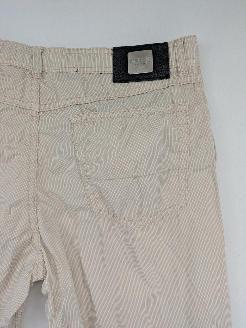 BRAX beige striped pants with logo, made from comfortable stretch cotton blend.