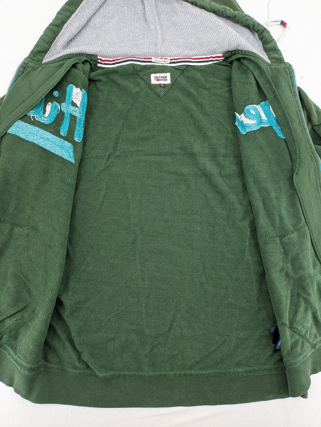 Tommy Hilfiger Denim green hoodie full zip with large graphic logo and grey waffle lining.