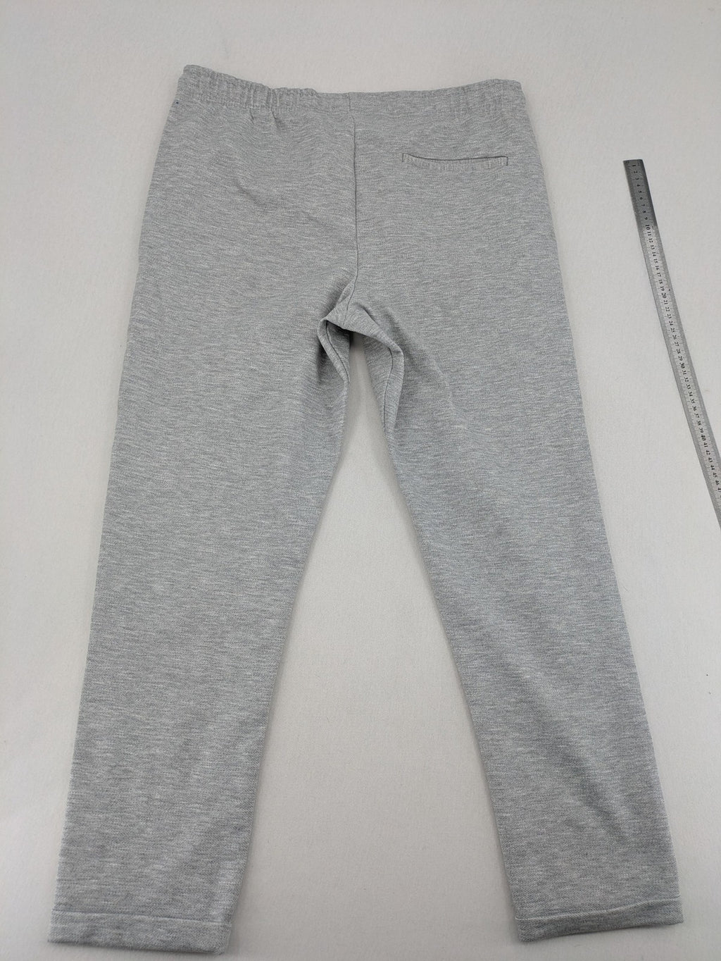 C&A grey sweatpants with elastic waistband, adjustable drawstring, and side pockets.