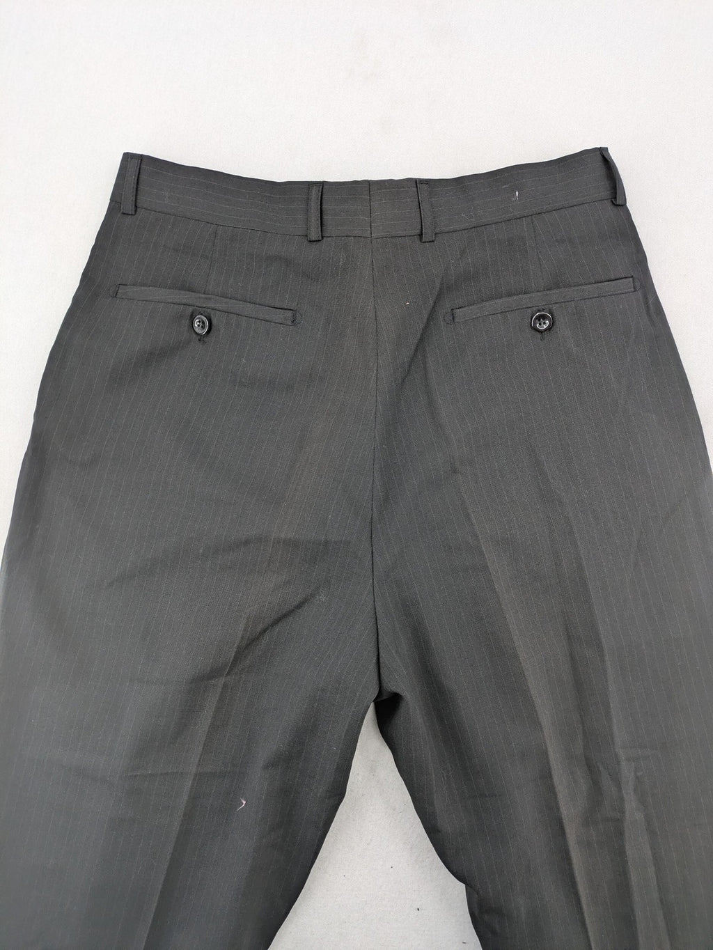 Wahl grey dress pants with pinstripe pattern and pleats, featuring side and back pockets.
