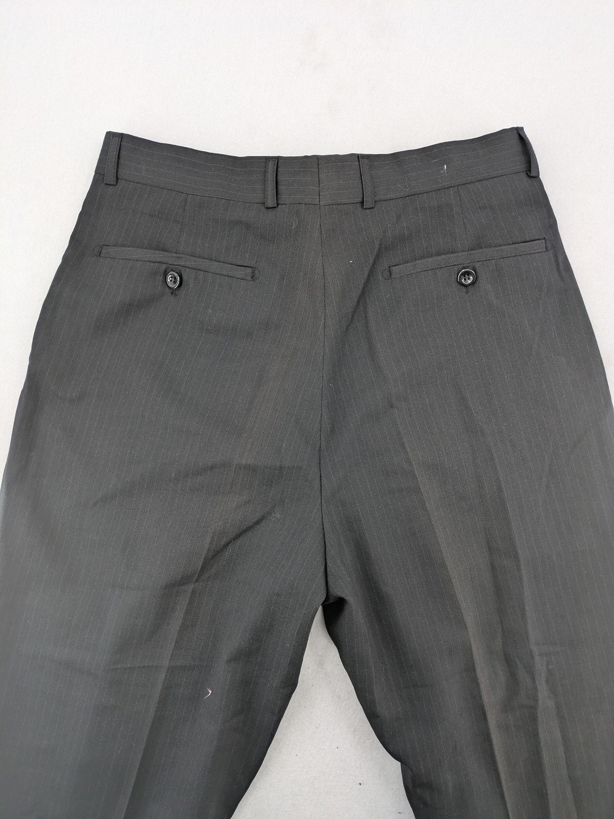Wahl grey dress pants with pinstripe pattern and pleats, featuring side and back pockets.