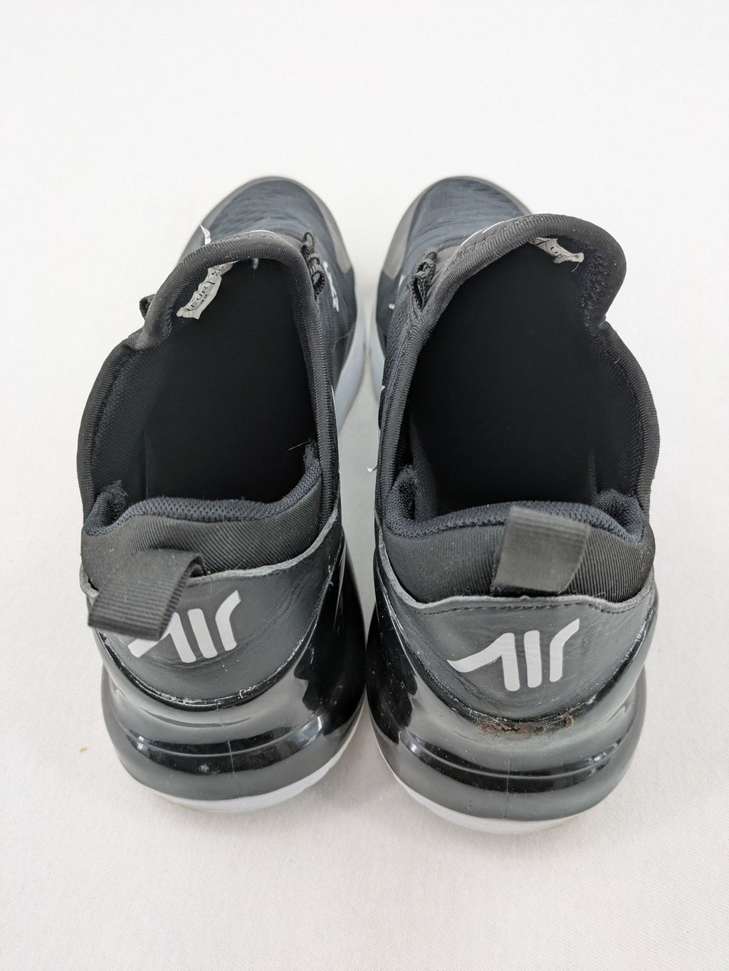 Nike Air Max 270 black and grey sneakers with large Air unit and white accents