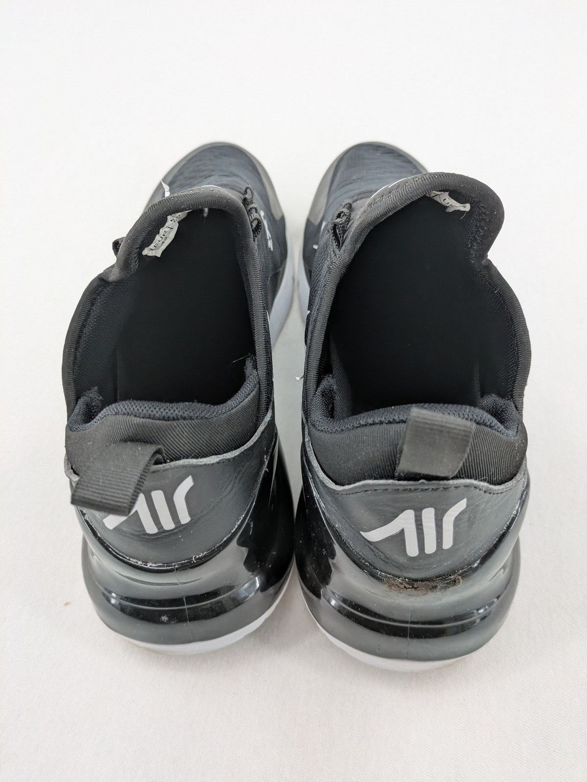 Nike Air Max 270 black and grey sneakers with large Air unit and white accents