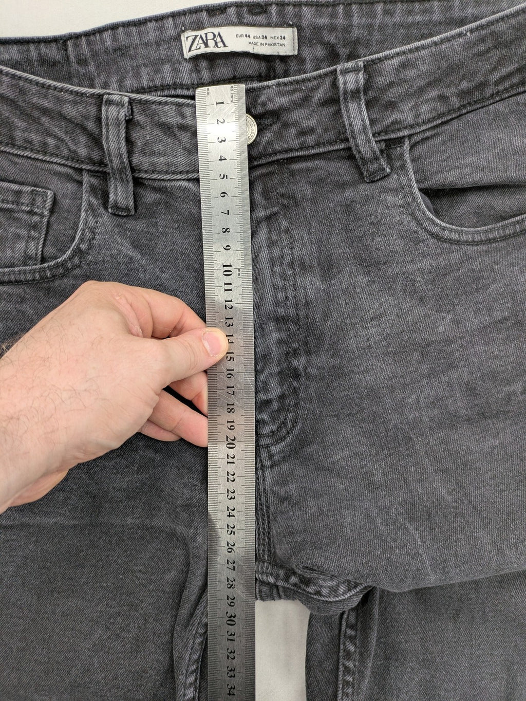 Zara black straight jeans faded wash five-pocket design with zipper closure.