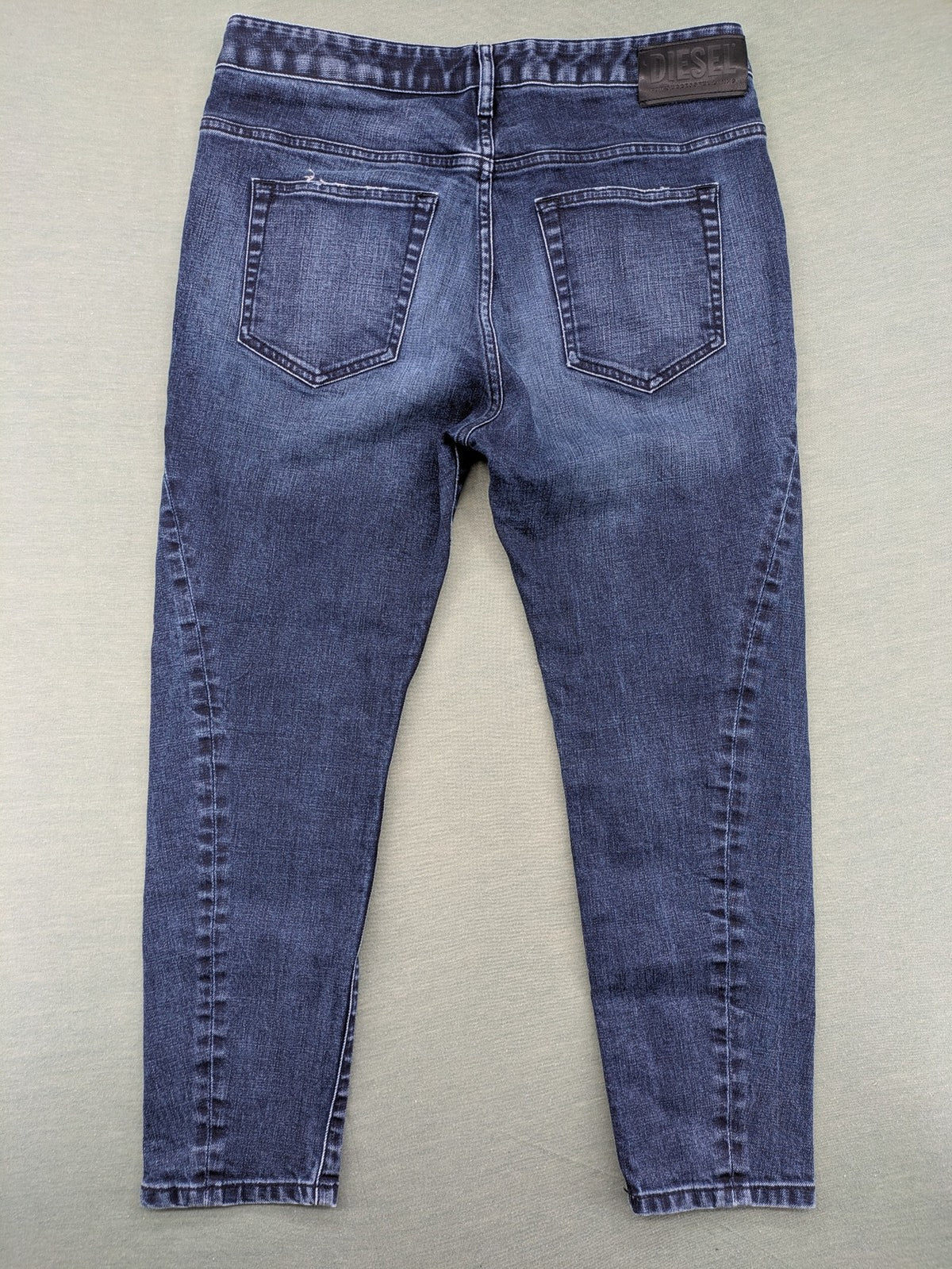 Diesel blue boyfriend jeans low waist dark wash stretch denim with logo patch.