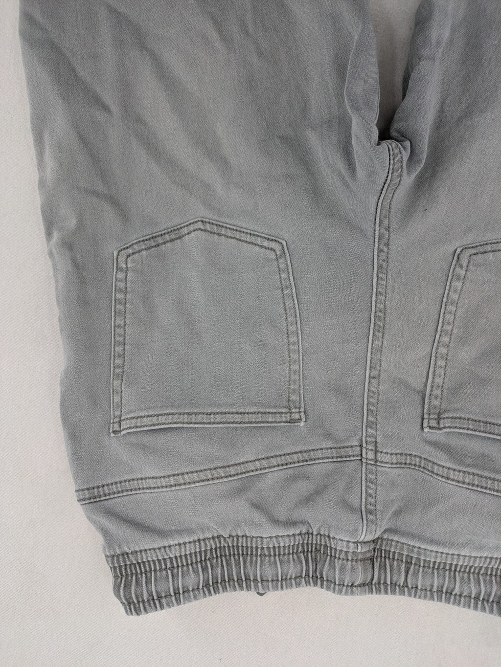 Denim & Co. grey jogger jeans with elastic waistband and ankle cuffs, cotton material.