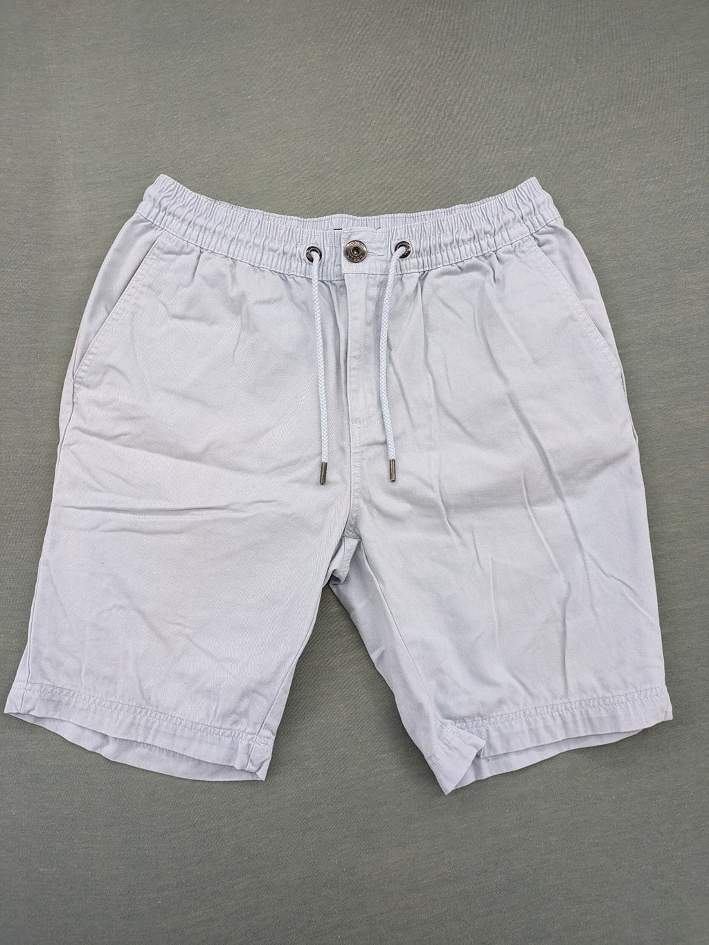 Bench blue shorts with elastic waistband, drawstring, and multiple pockets.