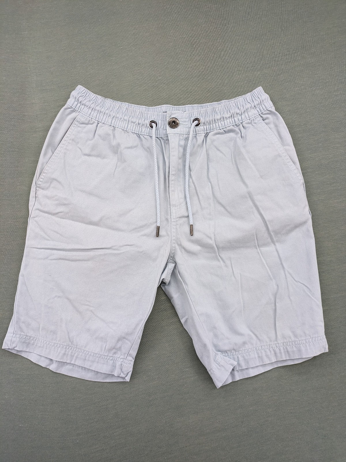 Bench blue shorts with elastic waistband, drawstring, and multiple pockets.