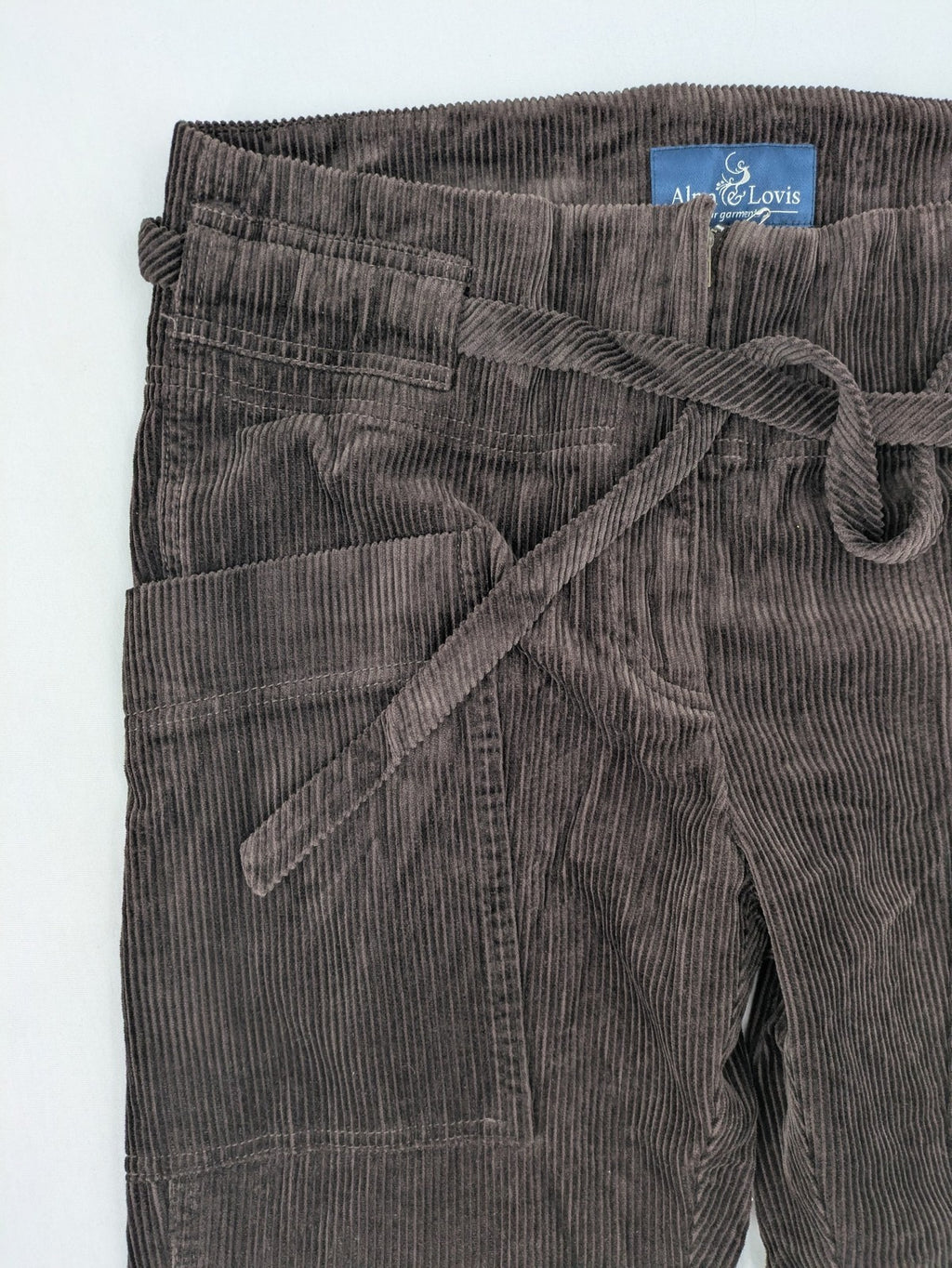 Alma & Lovis brown cord pants paperbag style with belt, made from organic cotton.