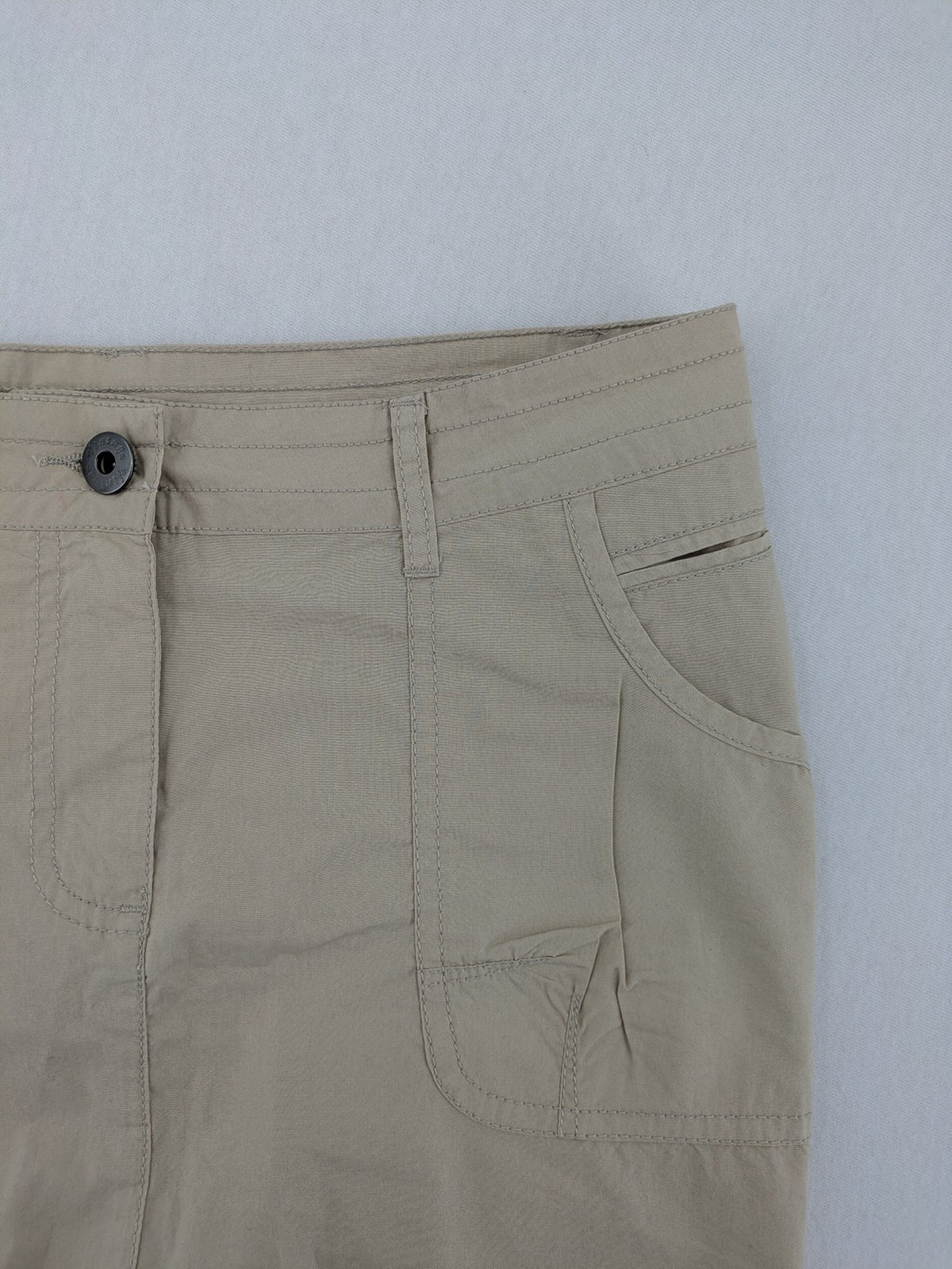 ESMARA beige cargo mini skirt with utility pockets and classic zipper button closure.