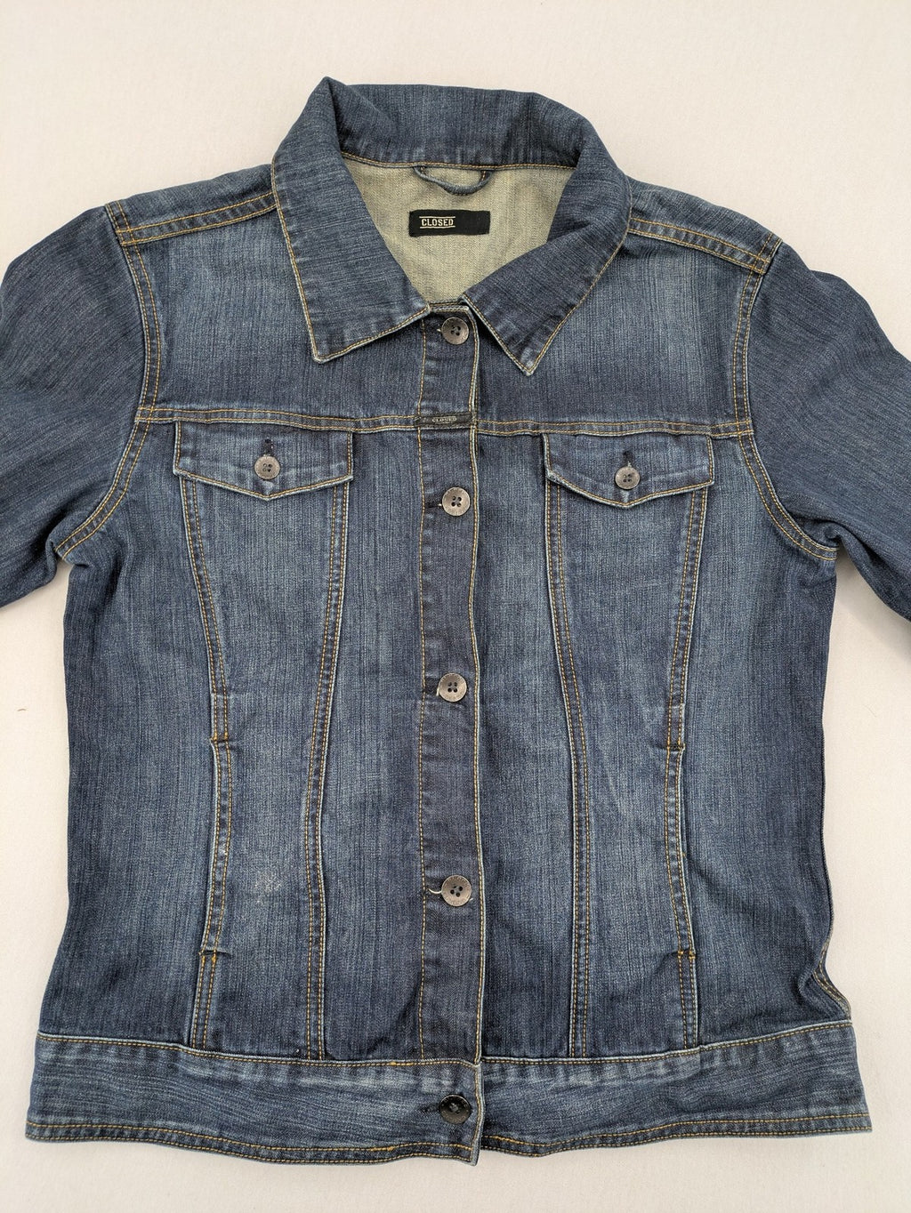 CLOSED blue denim trucker jacket with button front and two chest pockets.