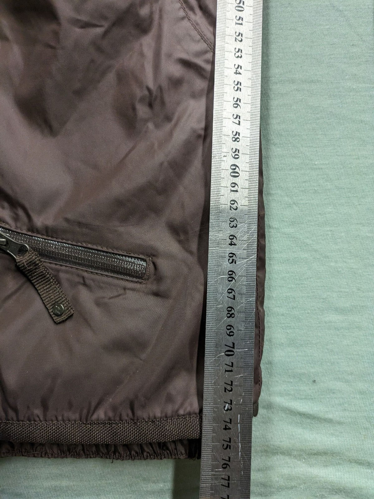 Thinsulate black and blue ski jumpsuit with hood and zippered pockets.