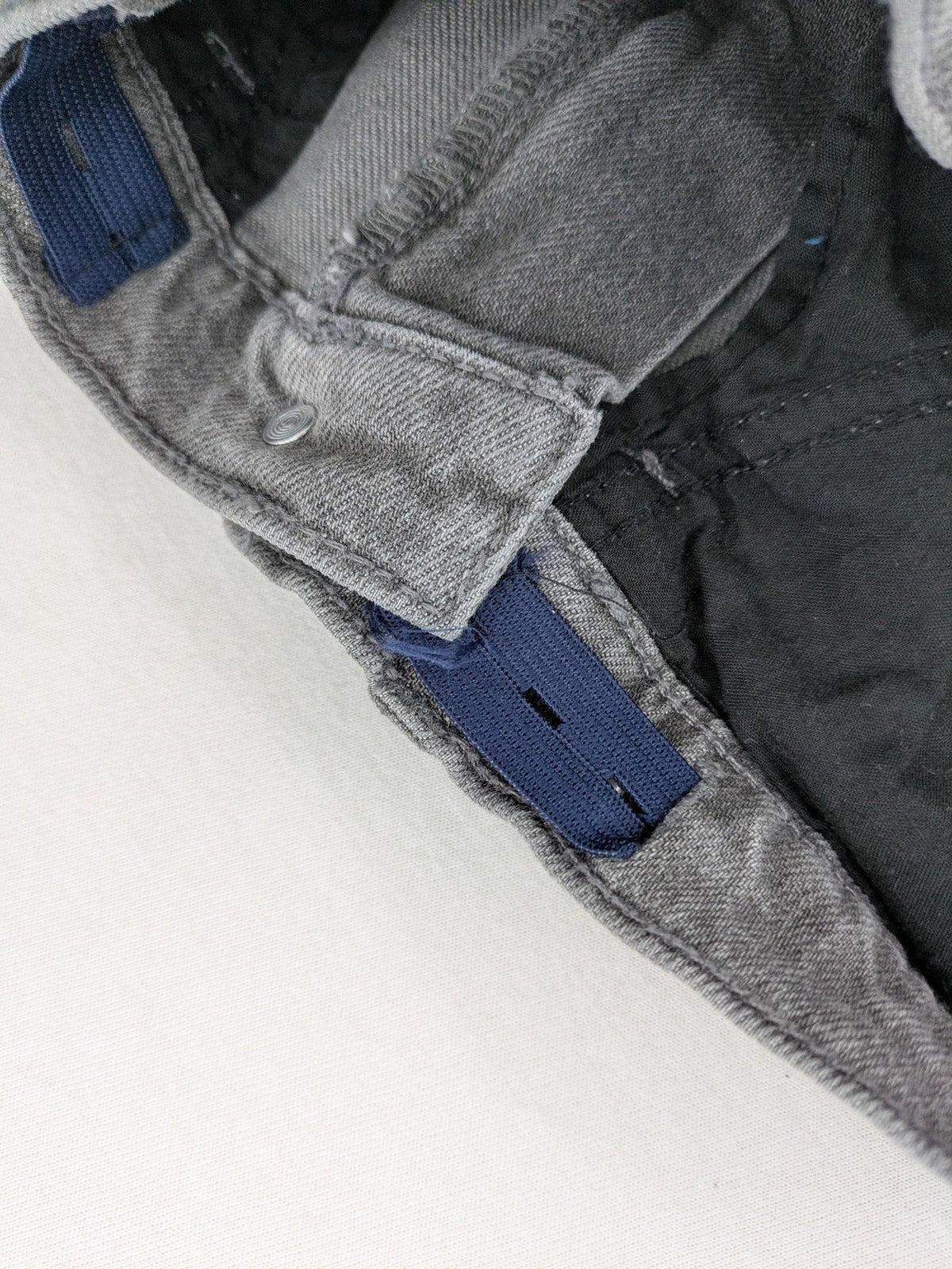 Old Navy navy straight jeans with adjustable waistband and classic 5-pocket design.