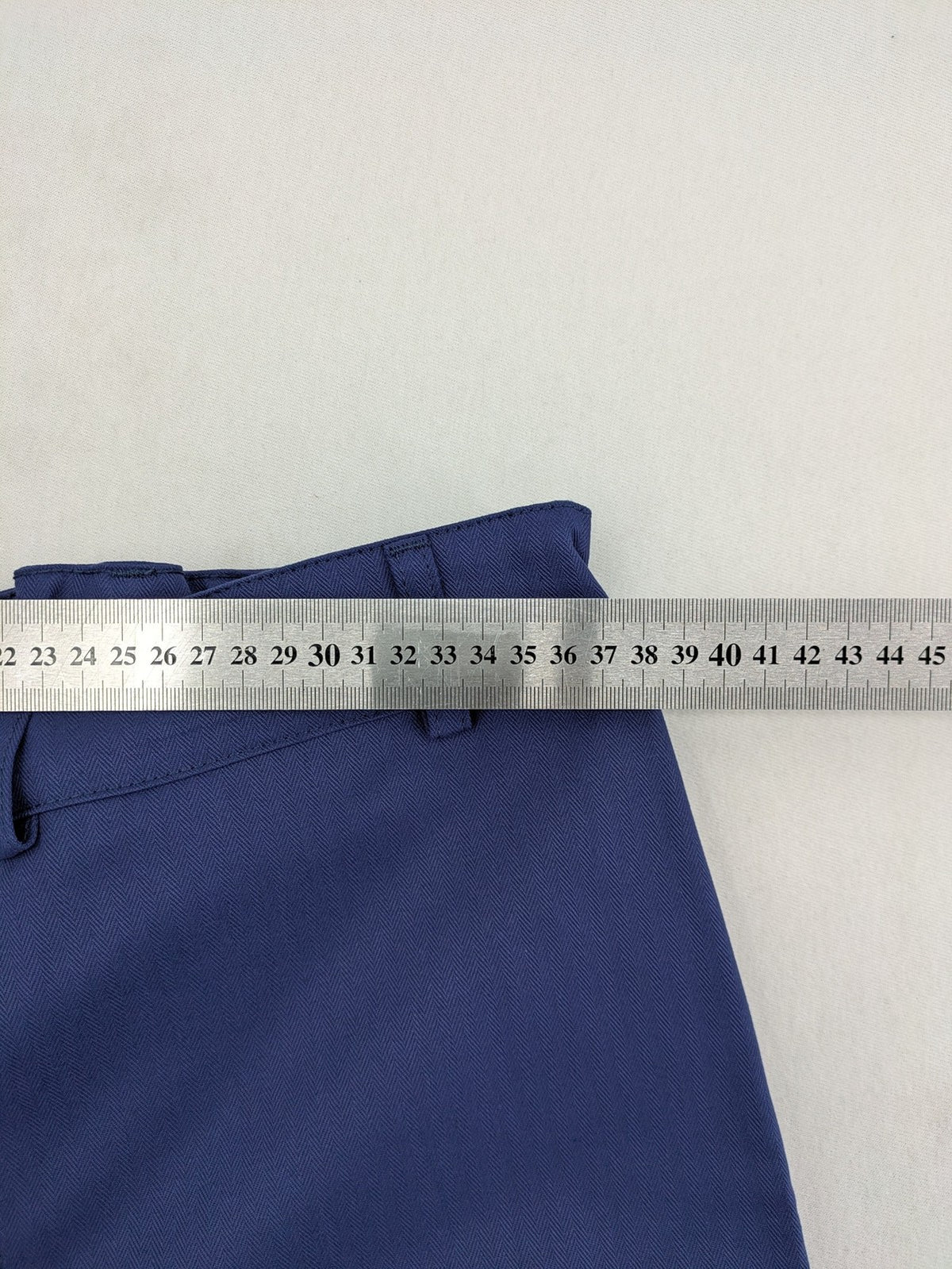 Uvex navy work trousers 100% cotton with button closure and belt loops.