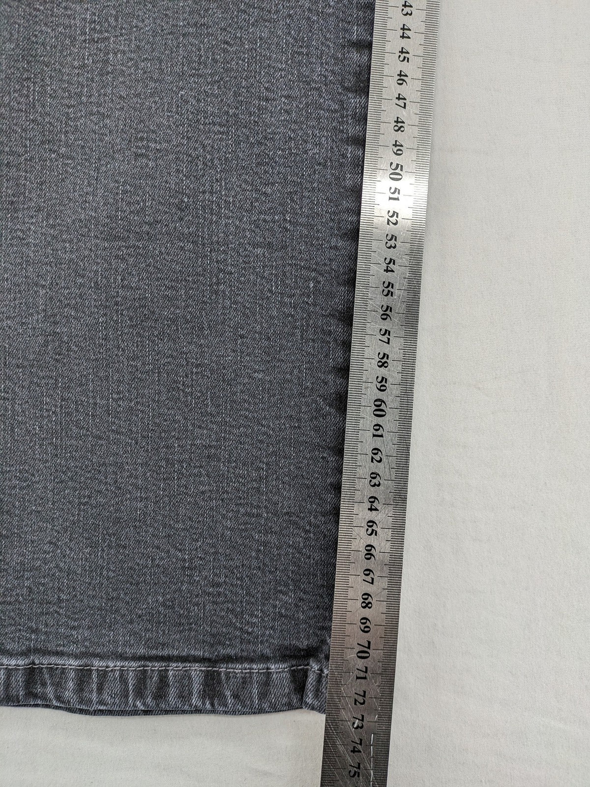 Arizona grey straight jeans with pearl-embellished wing appliqué on back pocket.