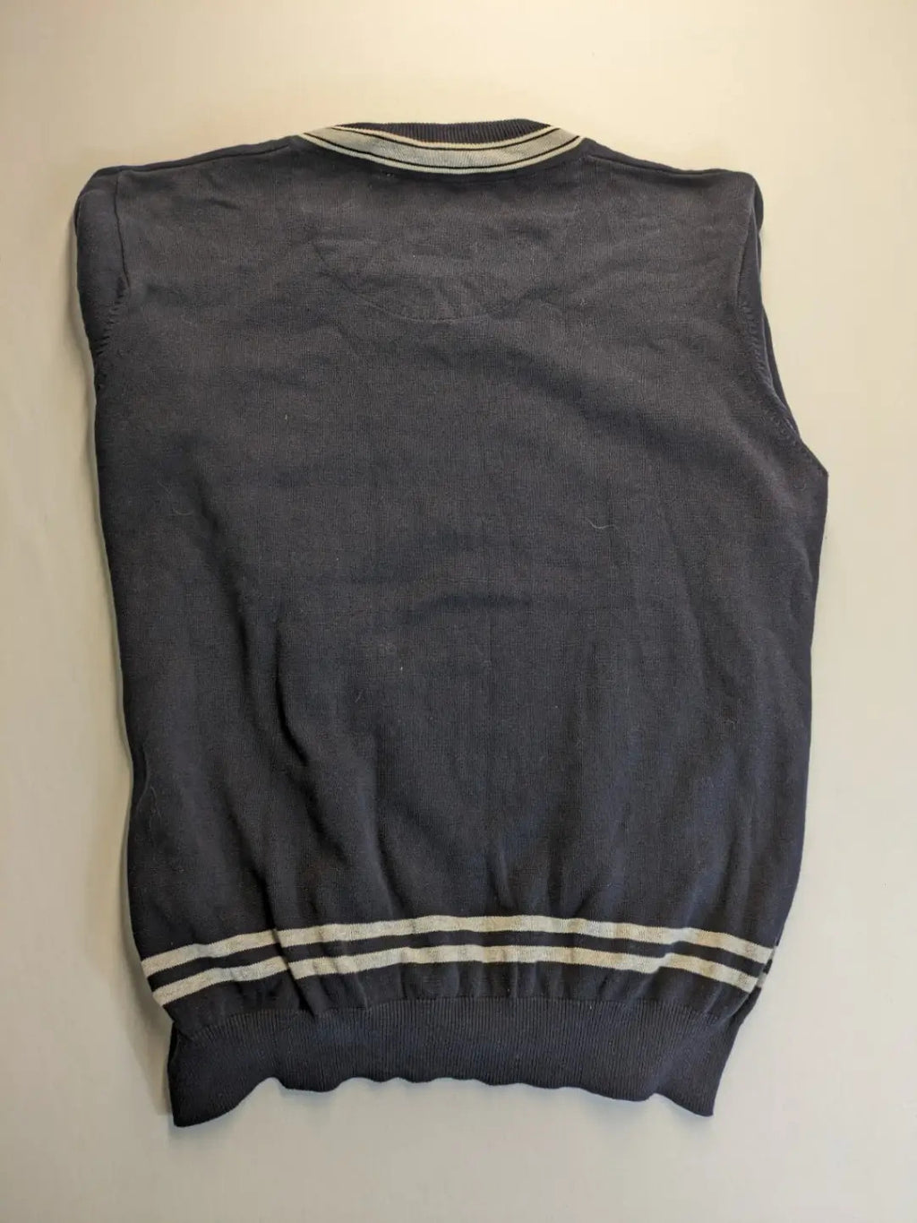 dunmore turtle neck jumper dark blue with striped trims and embroidered crest logo