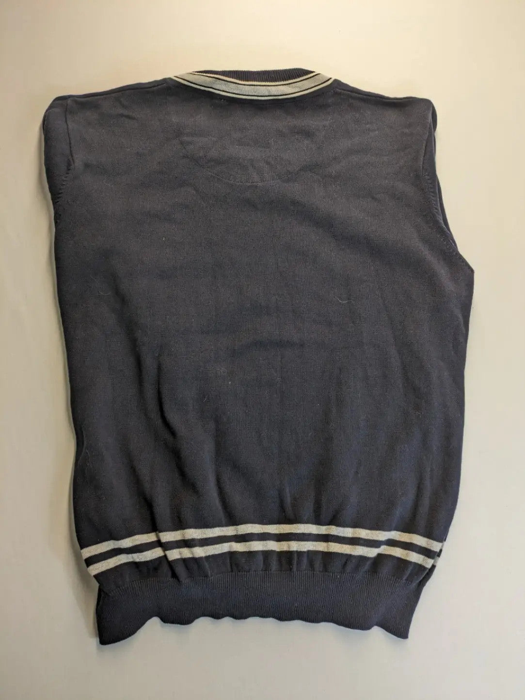 dunmore turtle neck jumper dark blue with striped trims and embroidered crest logo