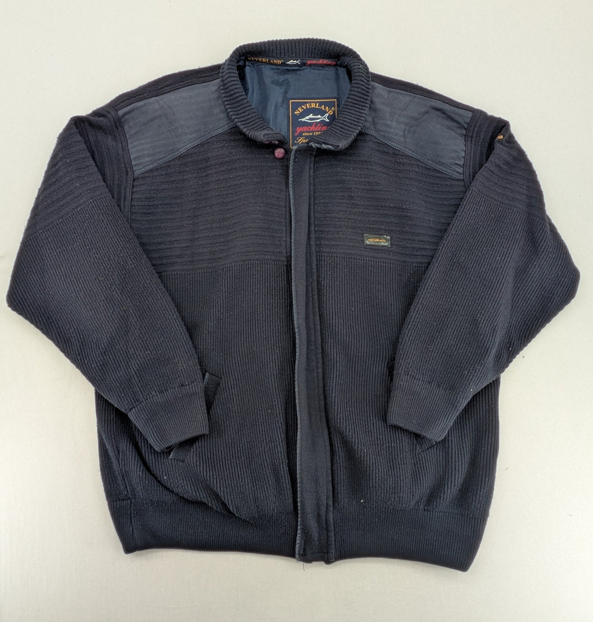 Neverland grey and navy full zip turtle neck jumper with ribbed knit and shoulder patches.