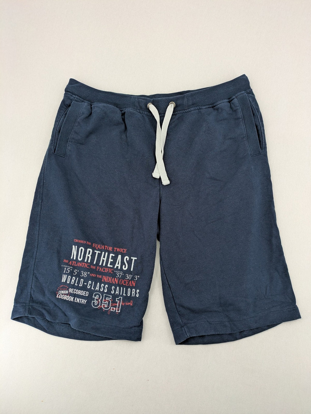 Livergy blue sweatshorts with "Northeast Sailors" graphic print and elastic waistband.