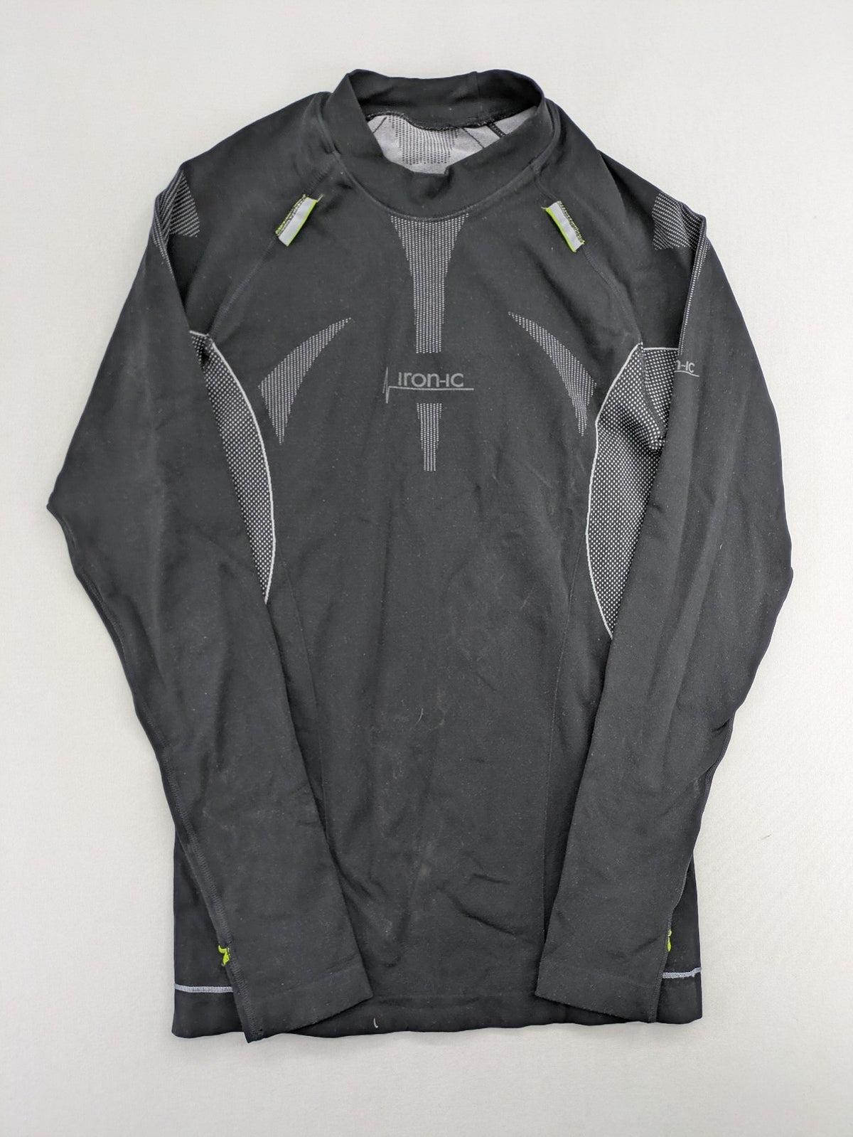 Iron-ic black long sleeve baselayer top with standing collar and thumbholes.