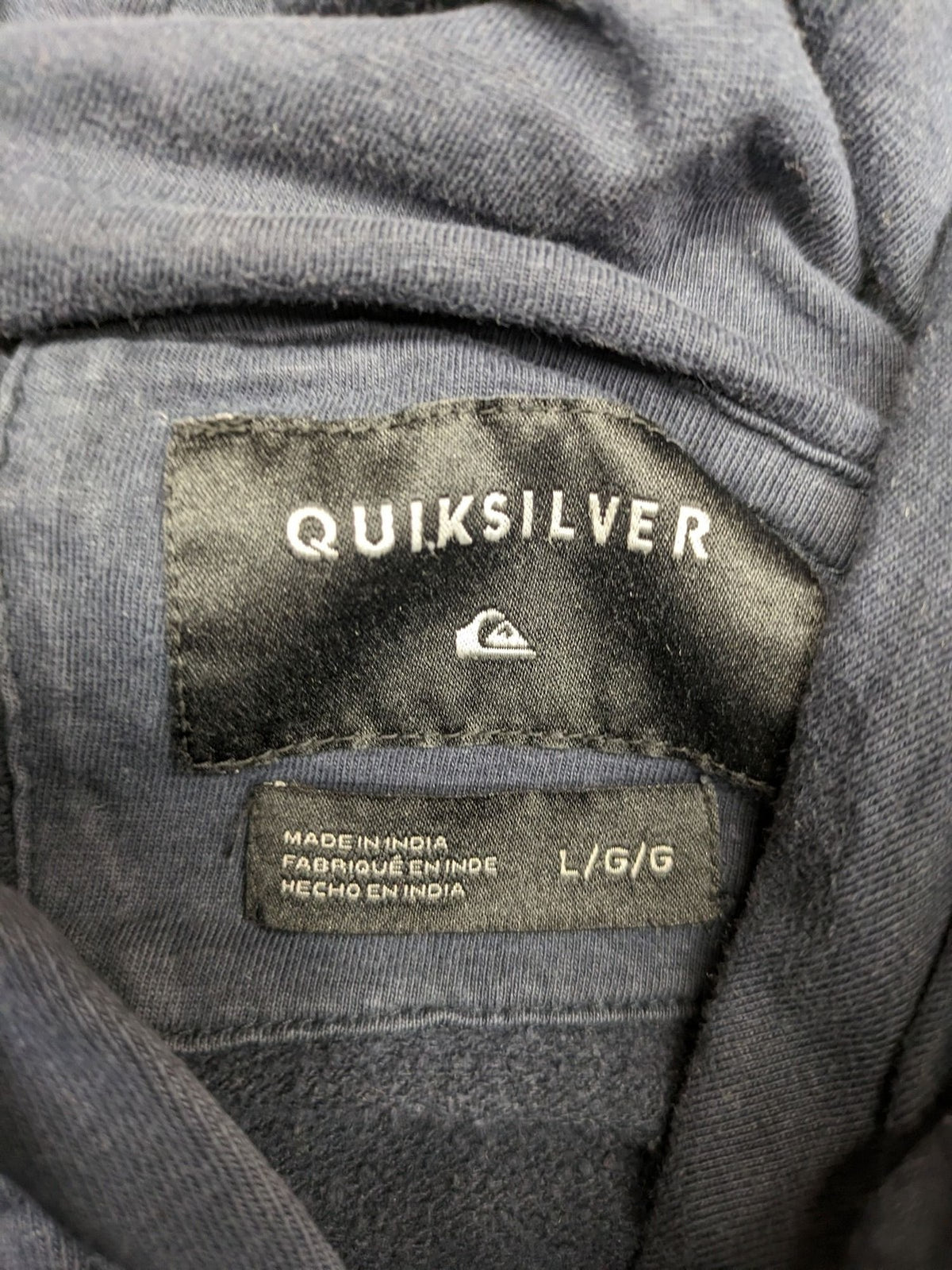 Quiksilver grey hoodie with logo graphic, kangaroo pocket, and adjustable hood.