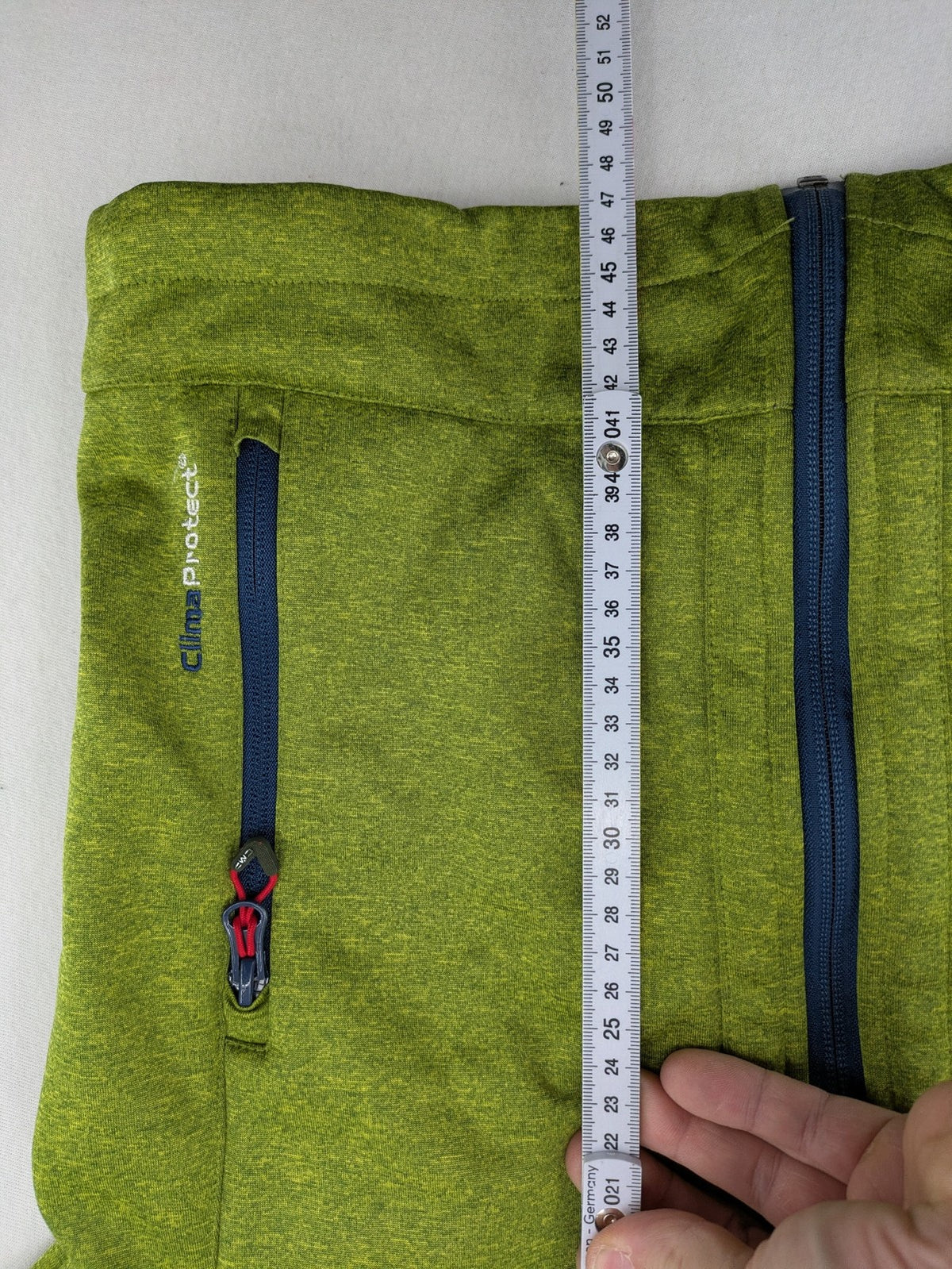 CMP outdoor coat blue and green with fleece lining, zip closure, and hood.