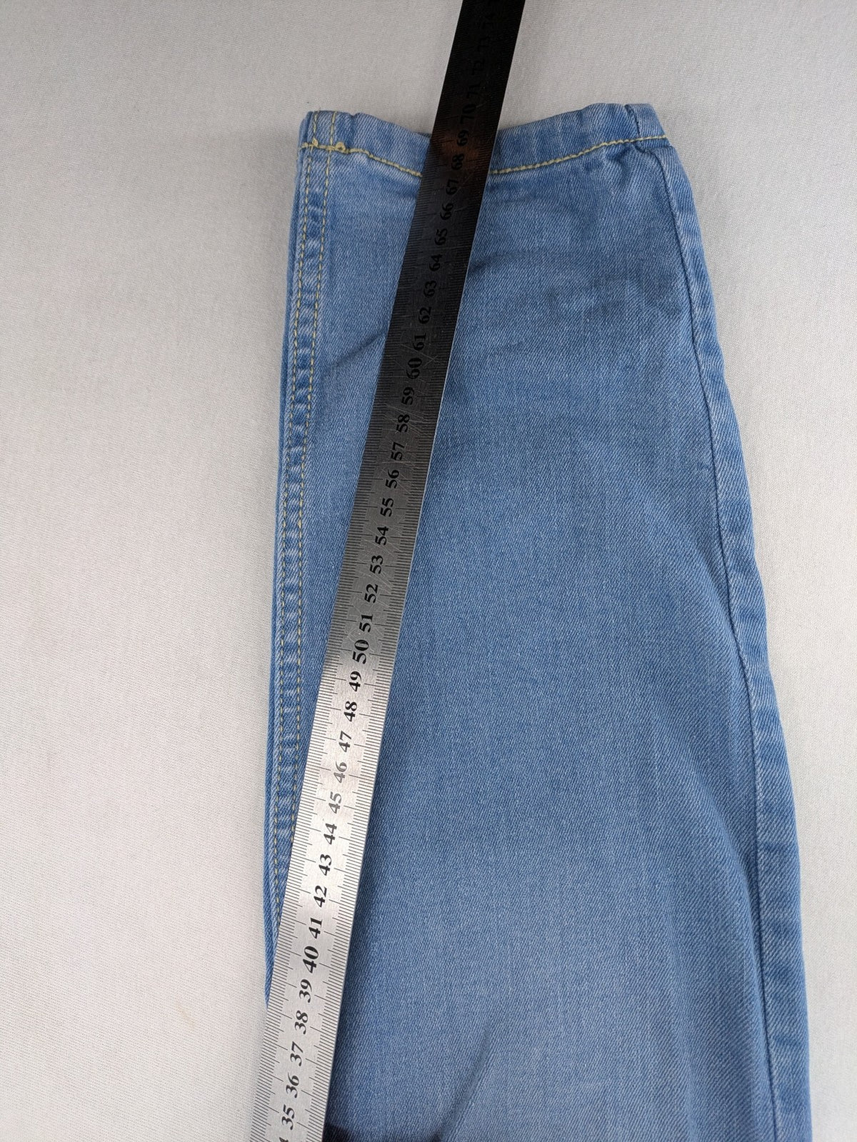Janina blue skinny fit jeggings with elastic waistband and angled front pockets.