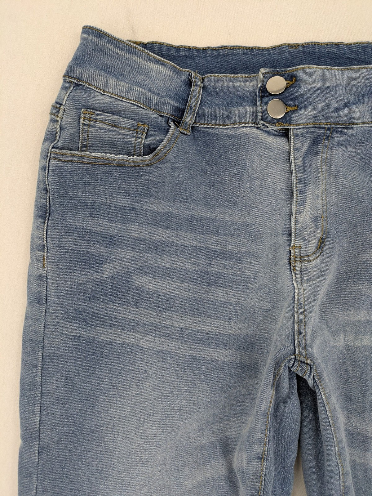 C&A blue bootcut jeans high waist stretch denim with double button closure.
