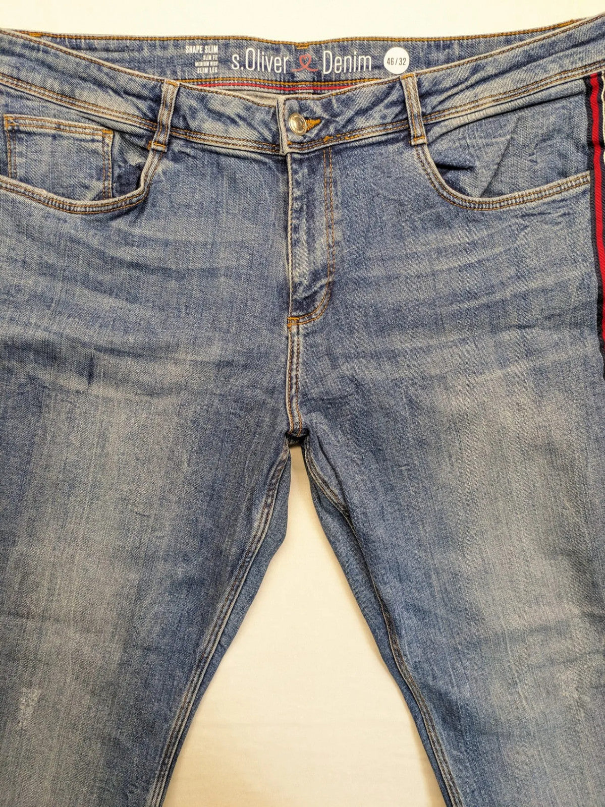 s.Oliver blue straight jeans with red and white side stripes, soft cotton blend material