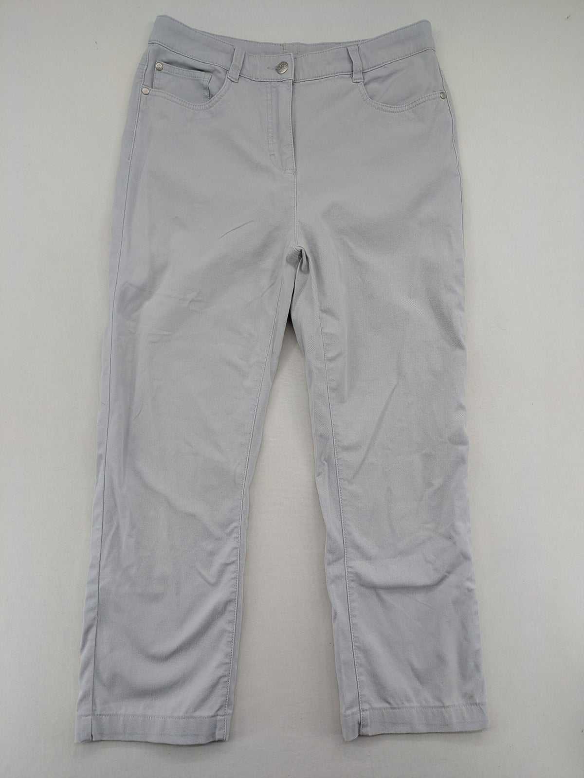Chino grey capri pants five-pocket design with subtle embroidery and stretch cotton blend.