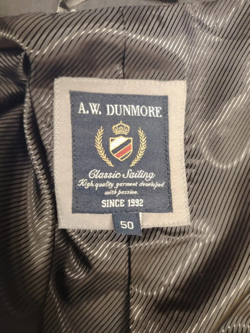 dunmore black blazer two-button design with falling lapels and multiple pockets