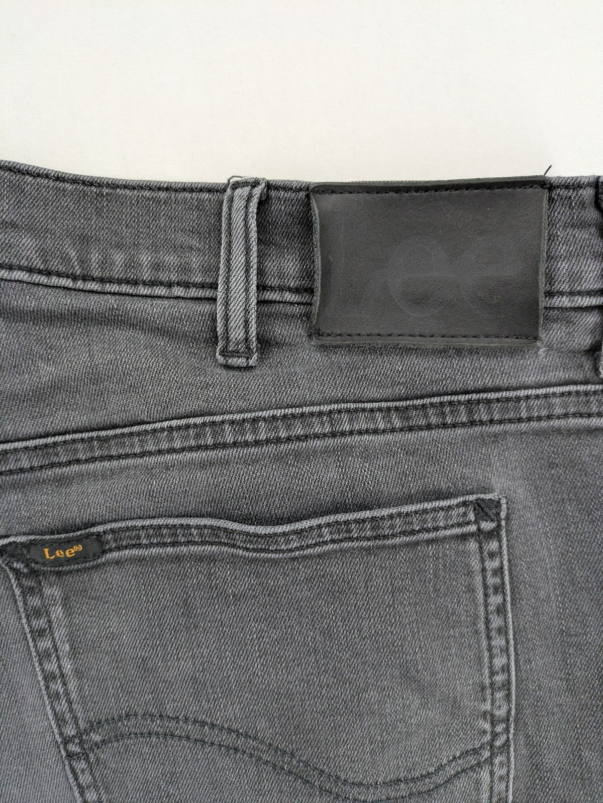 Lee straight jeans grey 5-pocket design with subtle branding on back pocket.