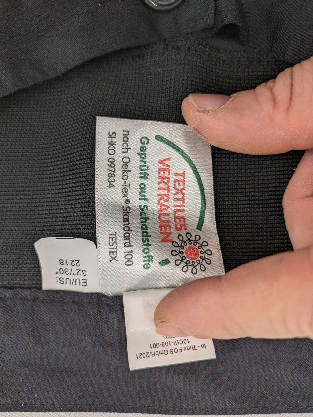 DHL grey cargo pants with iconic logo and multiple pockets, made from stretch cotton.