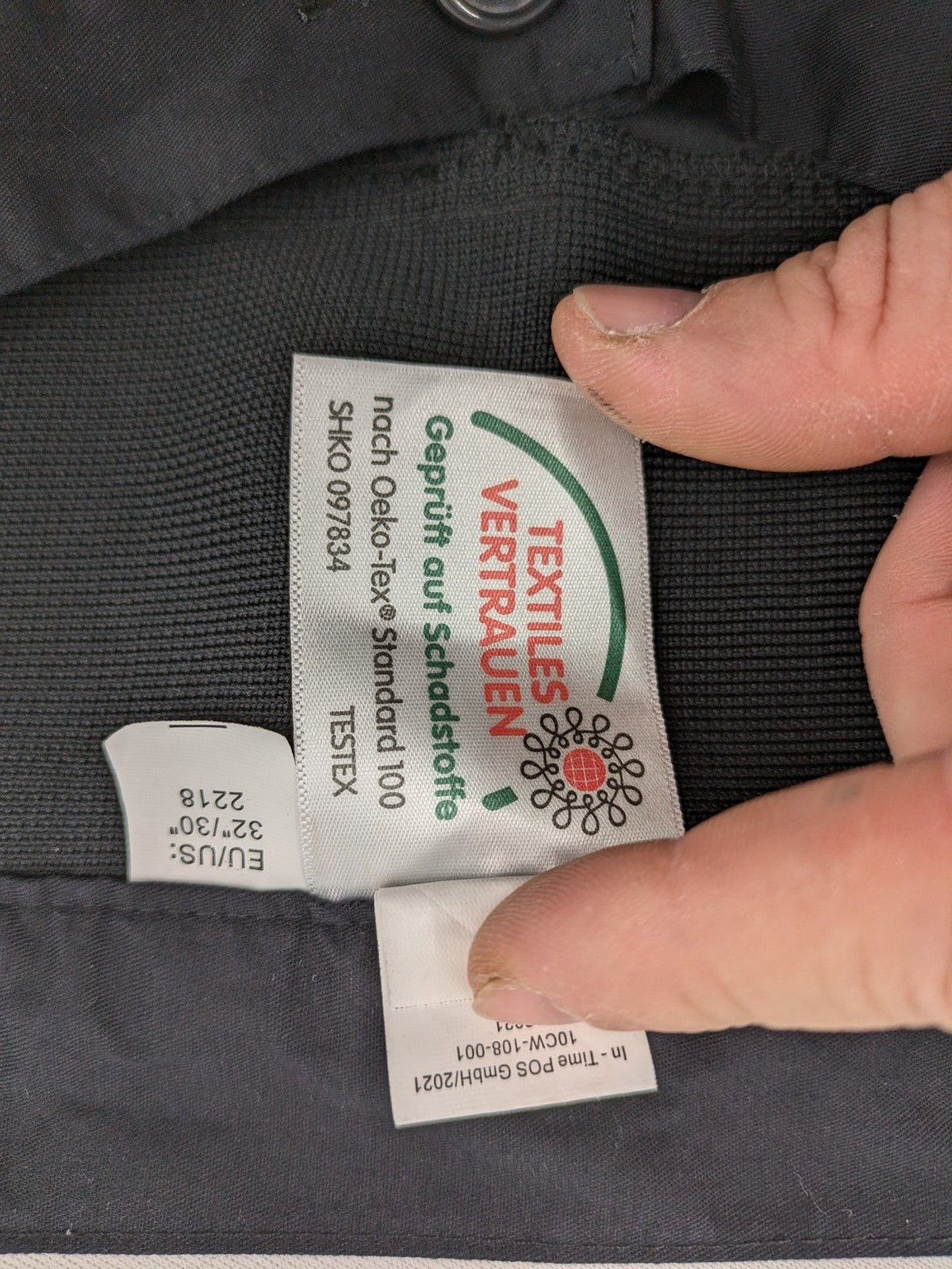 DHL grey cargo pants with iconic logo and multiple pockets, made from stretch cotton.