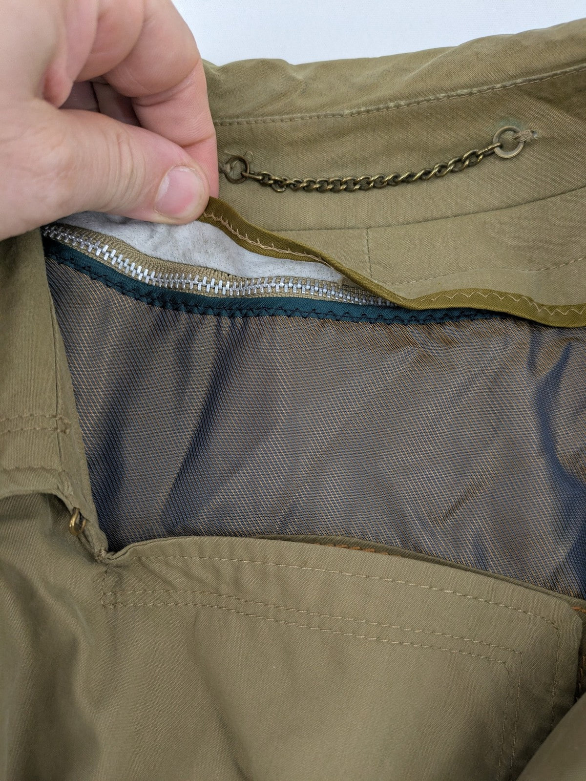 Studio Novum khaki trench coat double-breasted design with belt and wool lining.