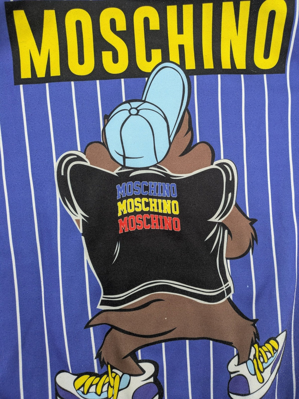 Moschino multi turtle neck jumper blue and white striped with Tasmanian Devil graphic.