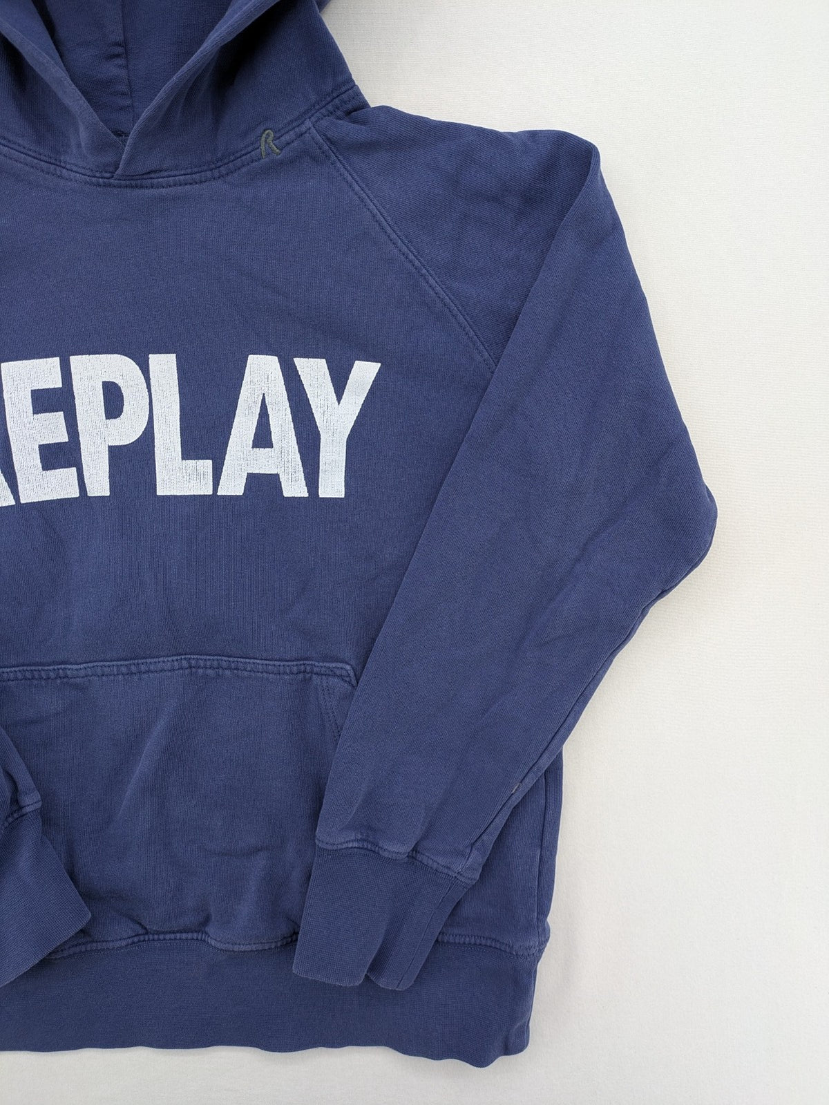 Replay blue turtle neck jumper with large logo print and kangaroo pocket, 100% cotton.