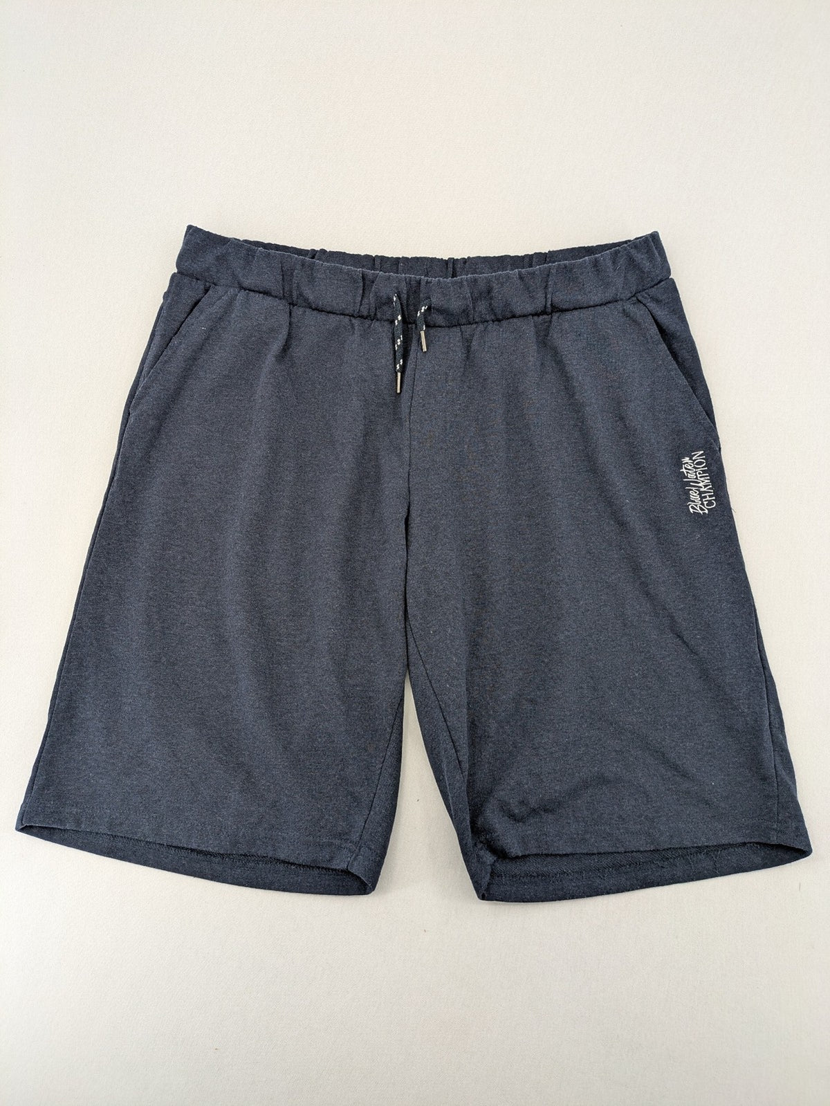Livergy blue sweatshorts with embroidered "Blue Water Champion" logo and adjustable drawstring.