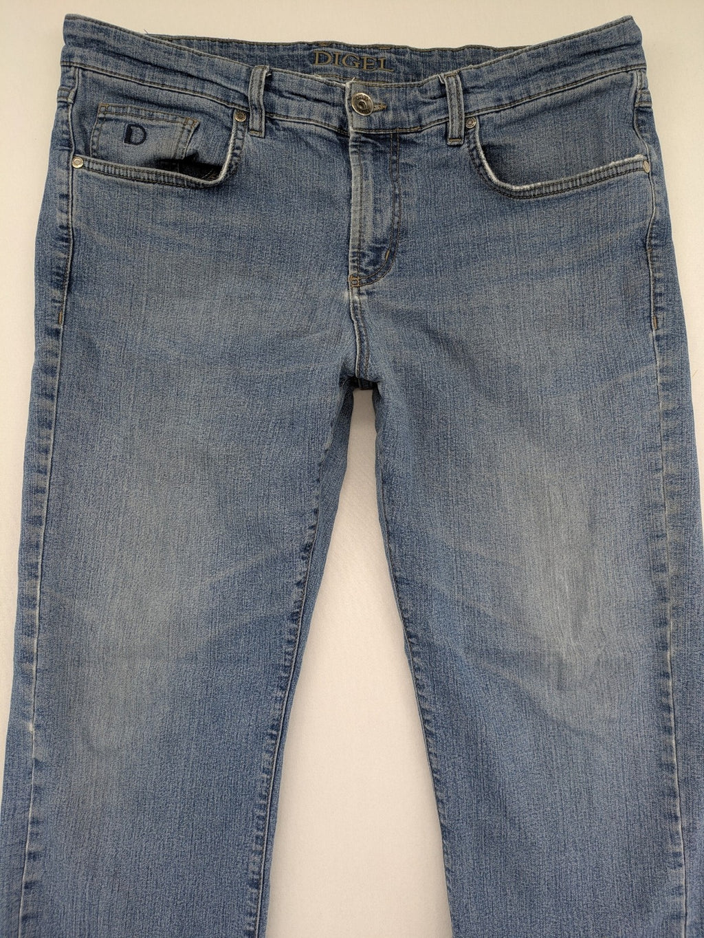 Digel blue straight jeans with classic medium wash and durable cotton denim material.