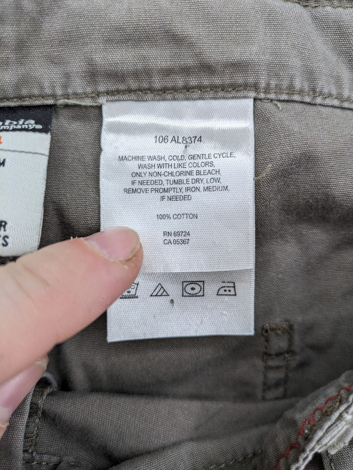 Columbia grey cargo pants with multiple pockets and drawstring waist, 100% cotton.