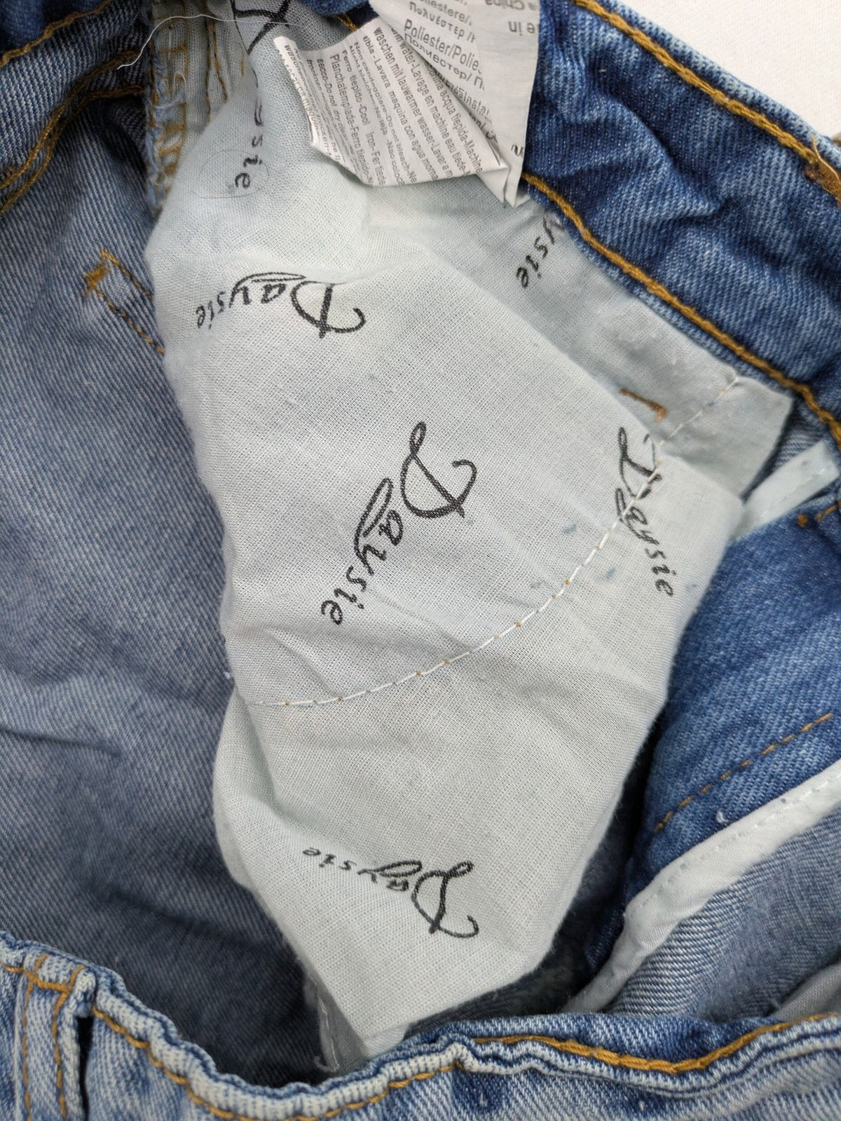 Daysie blue boyfriend jeans shorts with distressed rips and classic 5-pocket design.