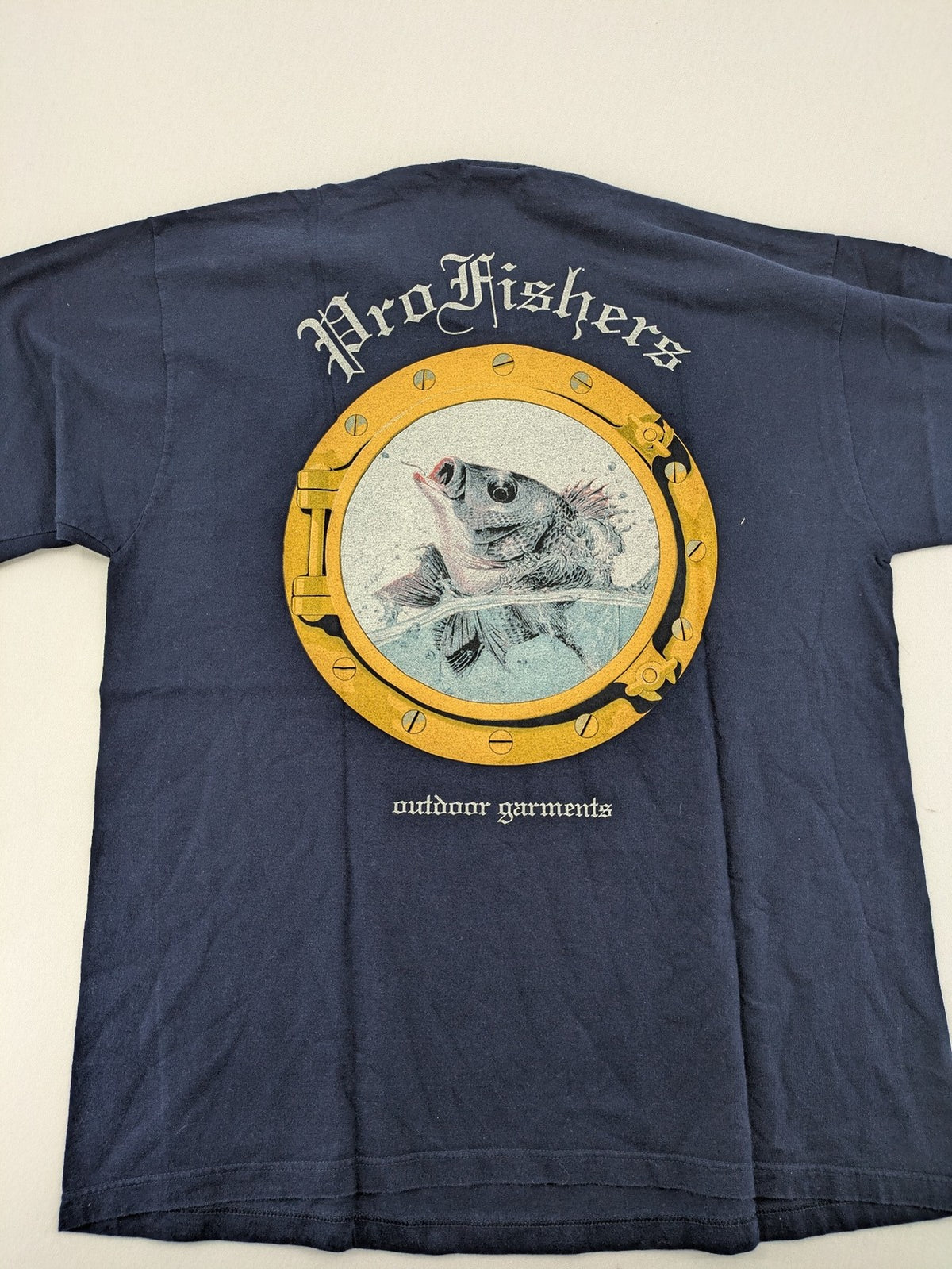 ProFishers navy t-shirt with compass print and large fish graphic on back.