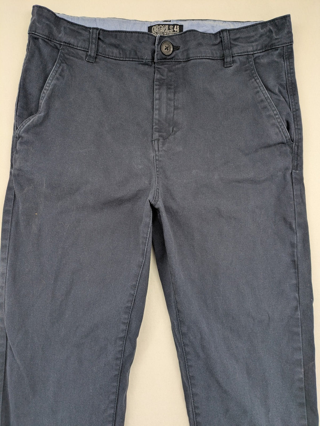 H&M navy chino pants with stretch, classic design, soft cotton blend material.