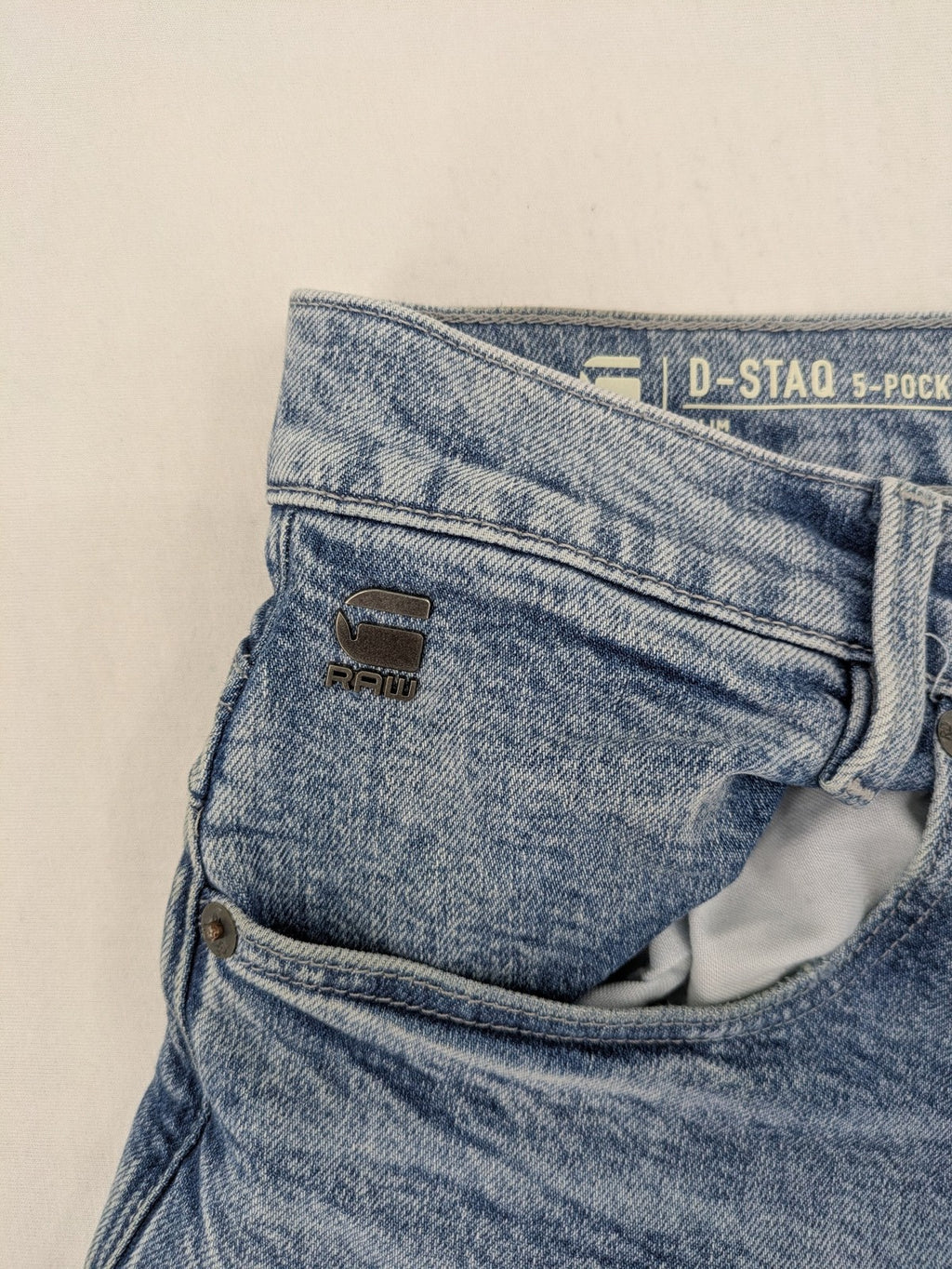 G-Star Raw blue slim fit jeans with 5-pocket design and light wash denim.