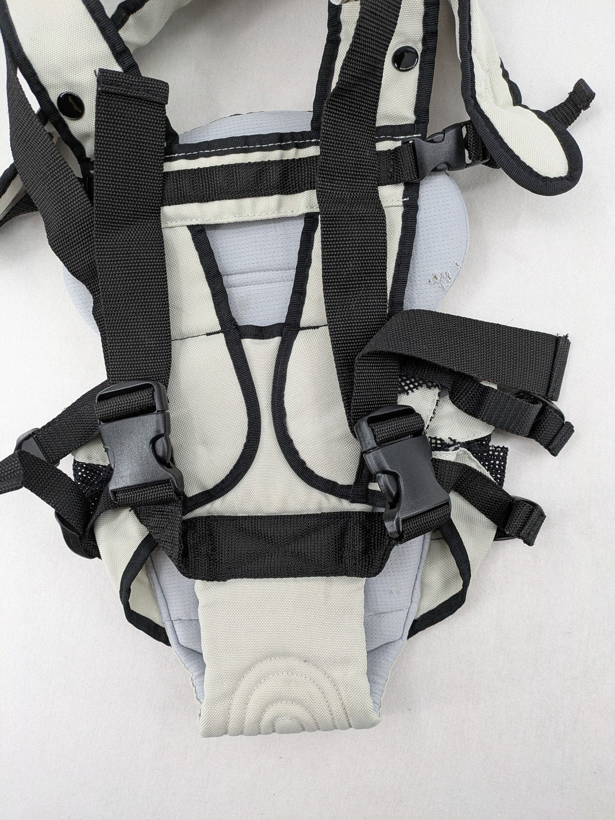Chicco beige and black baby carrier adjustable straps with padded support for comfort.