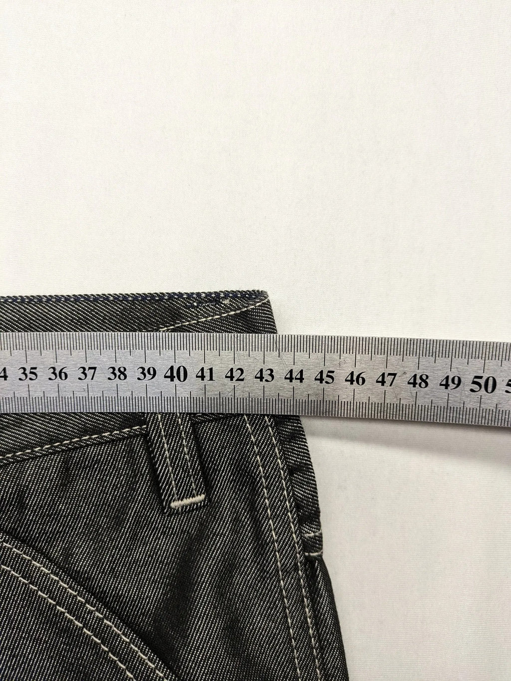 CIPO grey bootcut biker jeans with white contrast stitching and moto-inspired knee pleats.