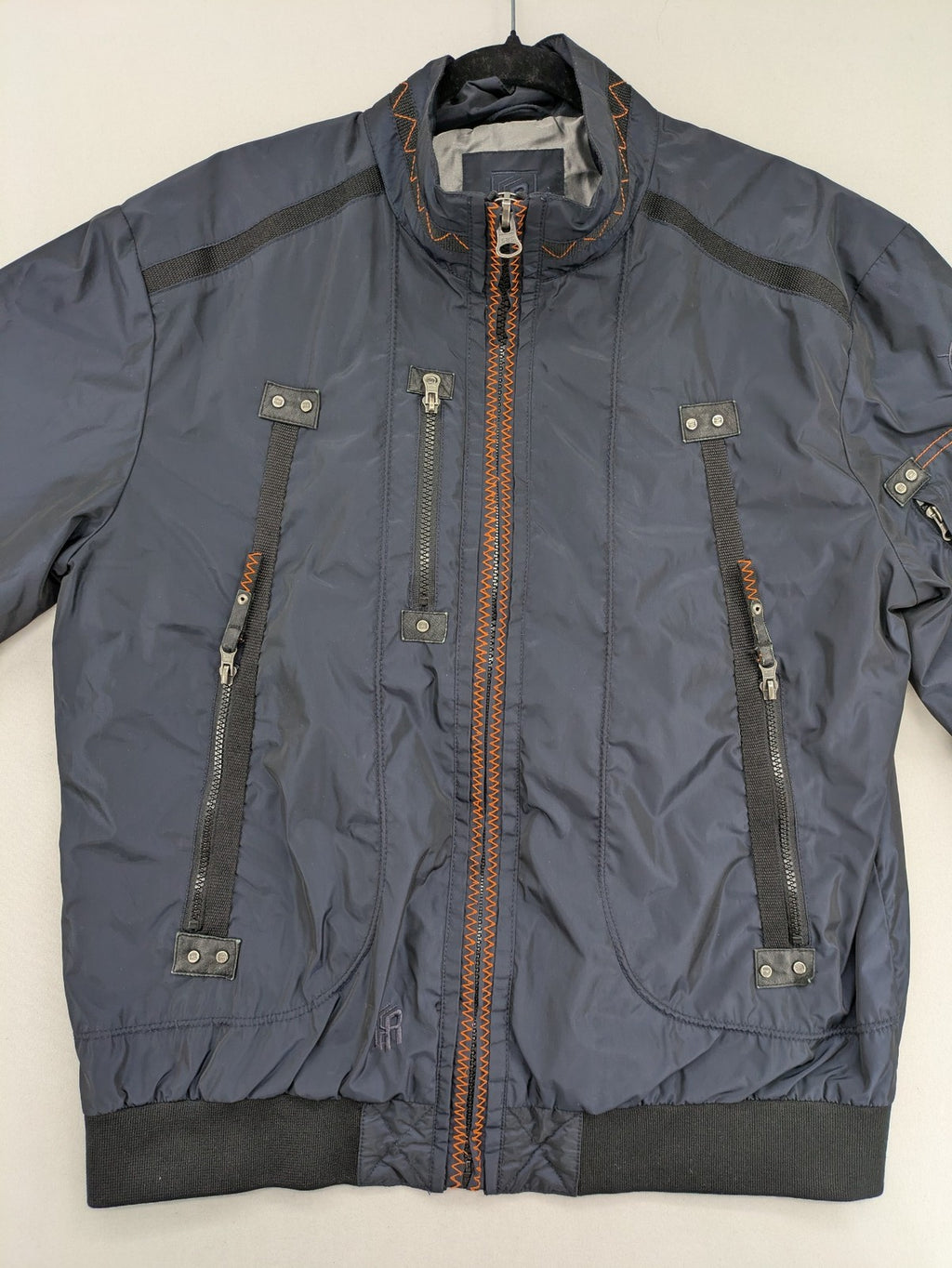Radloff grey navy bomber jacket with orange contrast stitching and zippered pockets.